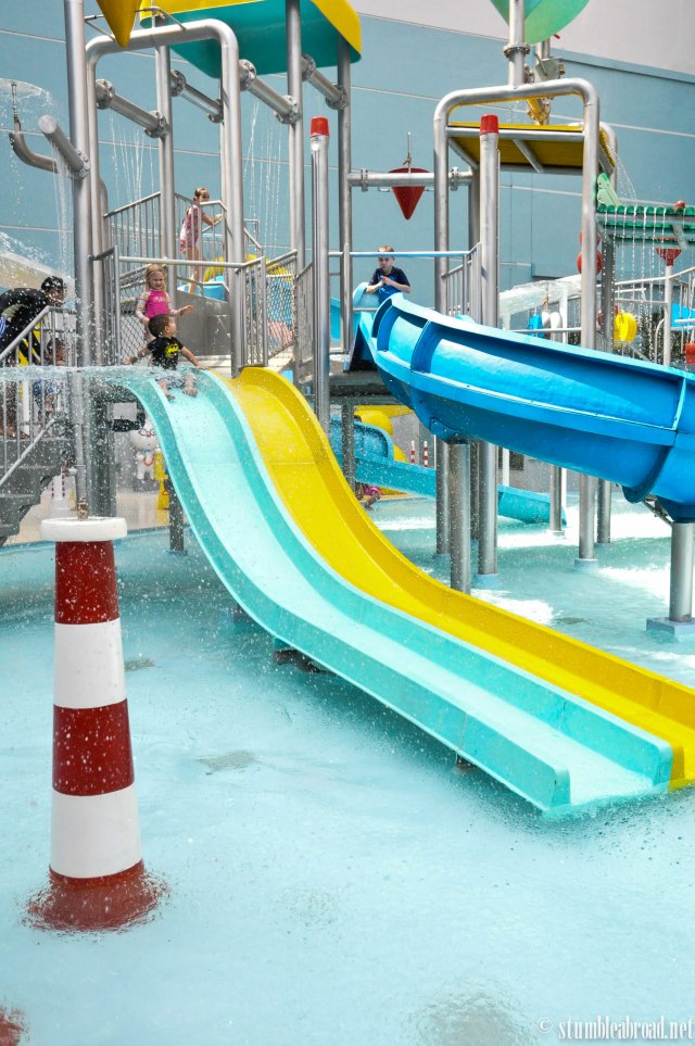 Joshua getting ready to go down the slide.