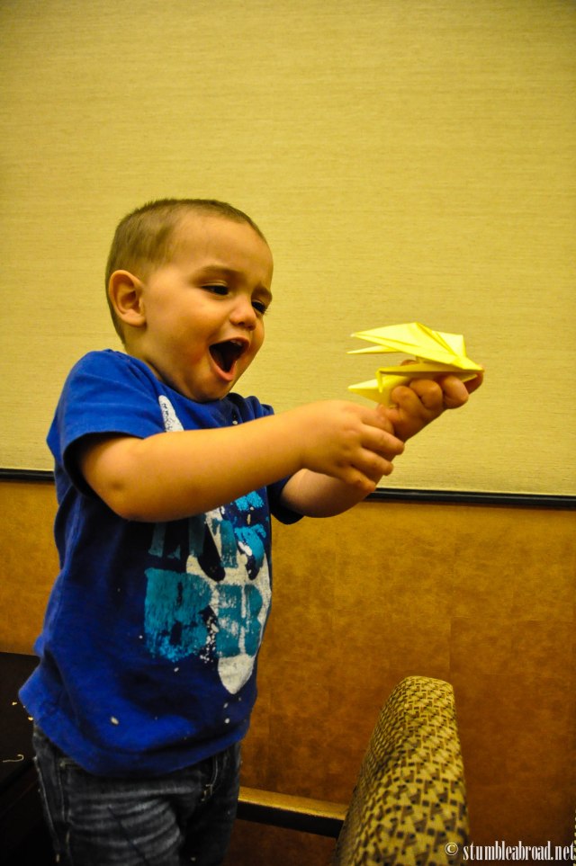 Playing with the paper crane.